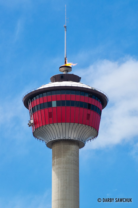 The top of the Calgary Tower with the torch lit in celebration.