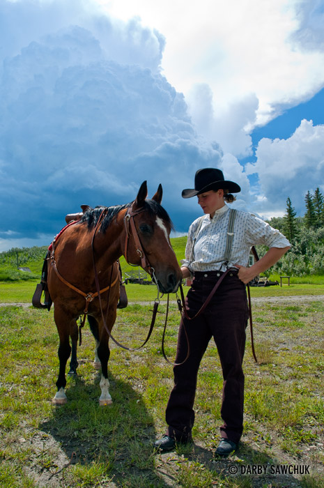 A cowgirl and her horse at the Bar-U ranch in Southern Alberta.