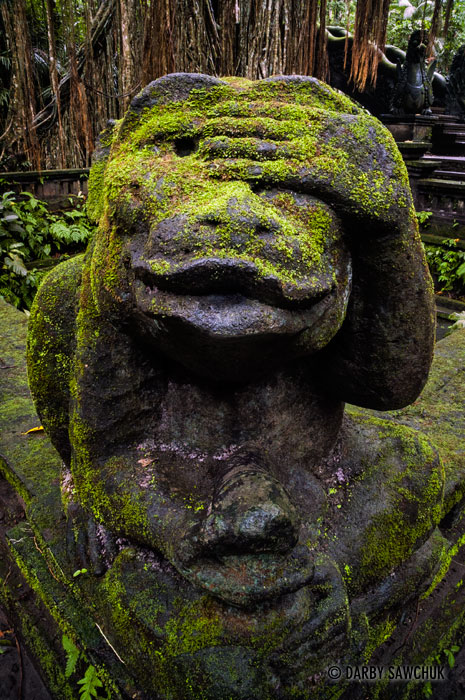 A monkey statue at the Sacred Monkey Forest Sanctuary in Ubud, Bali, Indonesia.