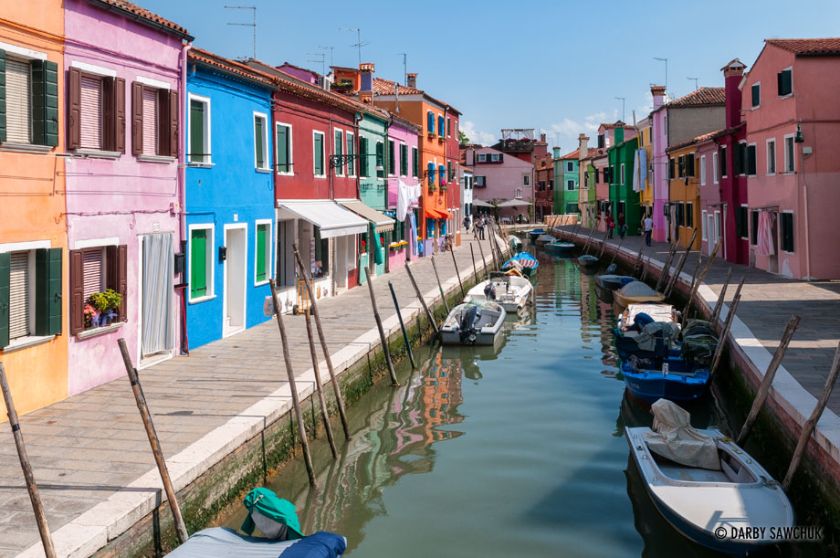 Colourful houses line the canals of Burano, a small island near Venice, Italy.
