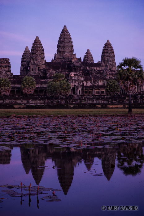 The central structure of Angkor Wat is reflected at dusk in Cambodia.