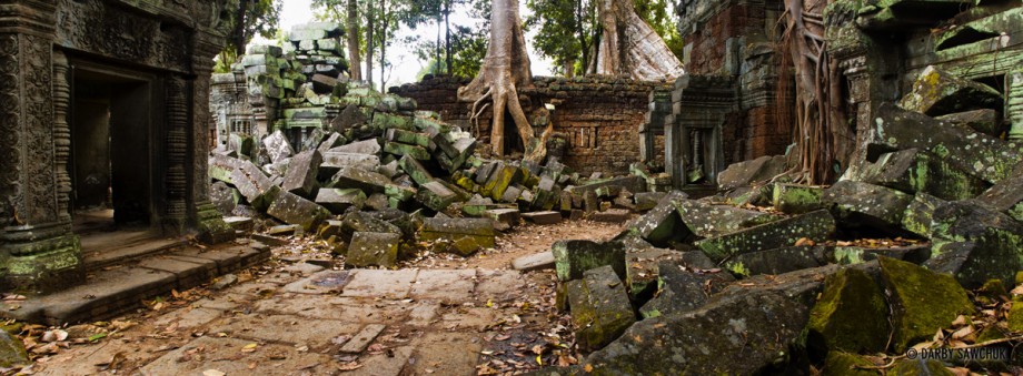 A panoramic view of a ruined courtyard in the temple of Ta Prohm, Cambodia.