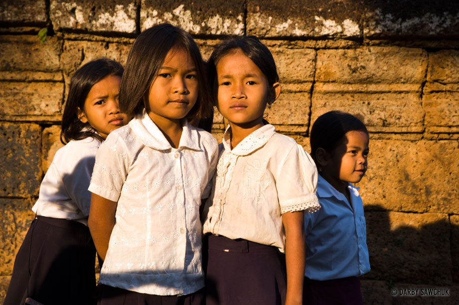 Elementary school students in a the schoolyard near the temple of Bakong in Cambodia.