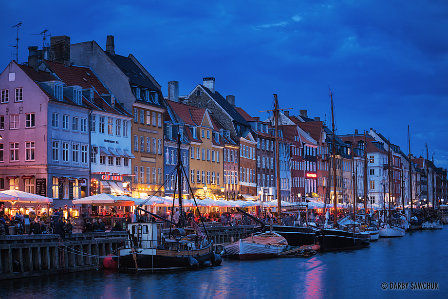Dusk descends on diners at the popular restaurants beside the Nyhavn Canal in Copenhagen, Denmark.