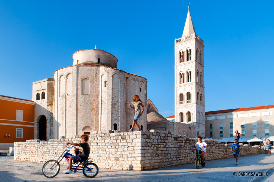 Children play on the ruins near St. Donatus Church in Zadar.
