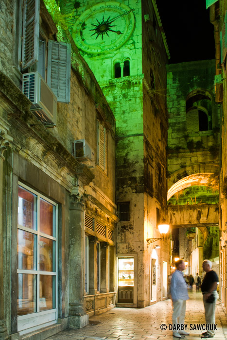 Two men converse in an alleyway in Diocletian's Palace in Split, Croatia.