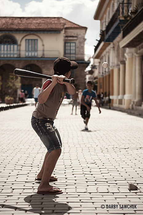 Children play baseball in Plaza Vieja, one of the main squares in the old town of Havana.