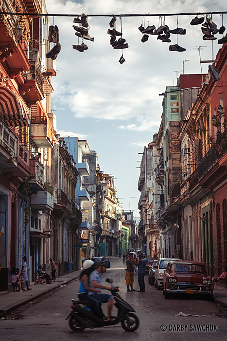 Shoes dangle from a power line above the streets of central Havana.