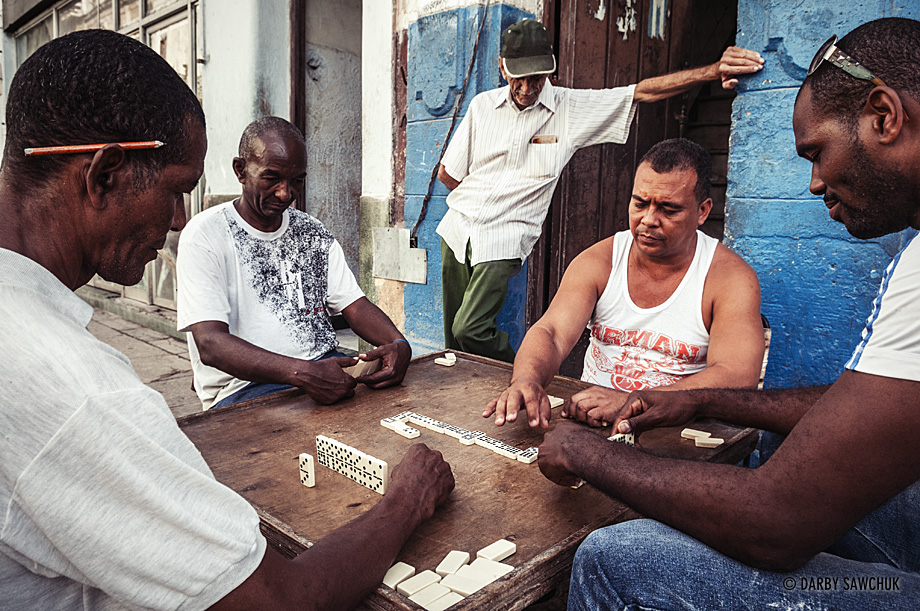 Men play dominoes, one of the nation's favourite pasttimes in Havana, Cuba.