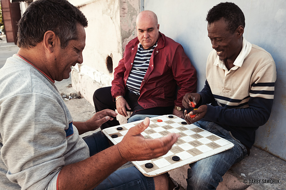 Men play checkers in the streets of Cienfuegos, Cuba.