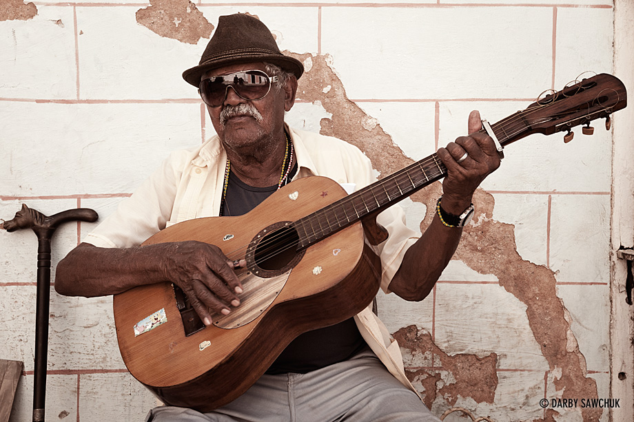 A guitarist plays music in the streets of Havana, Cuba.