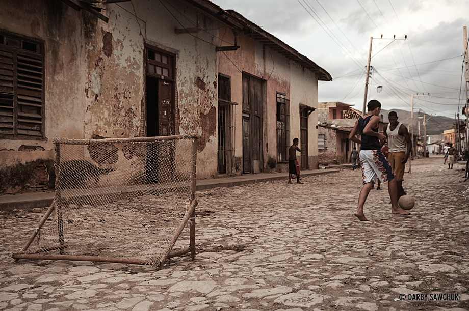 Boys play football in the cobblestone streets of Unesco World Heritage Site Trinidad, Cuba