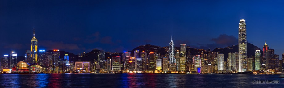 A panoramic view of the skyscrapers on HOng Kong island at night.