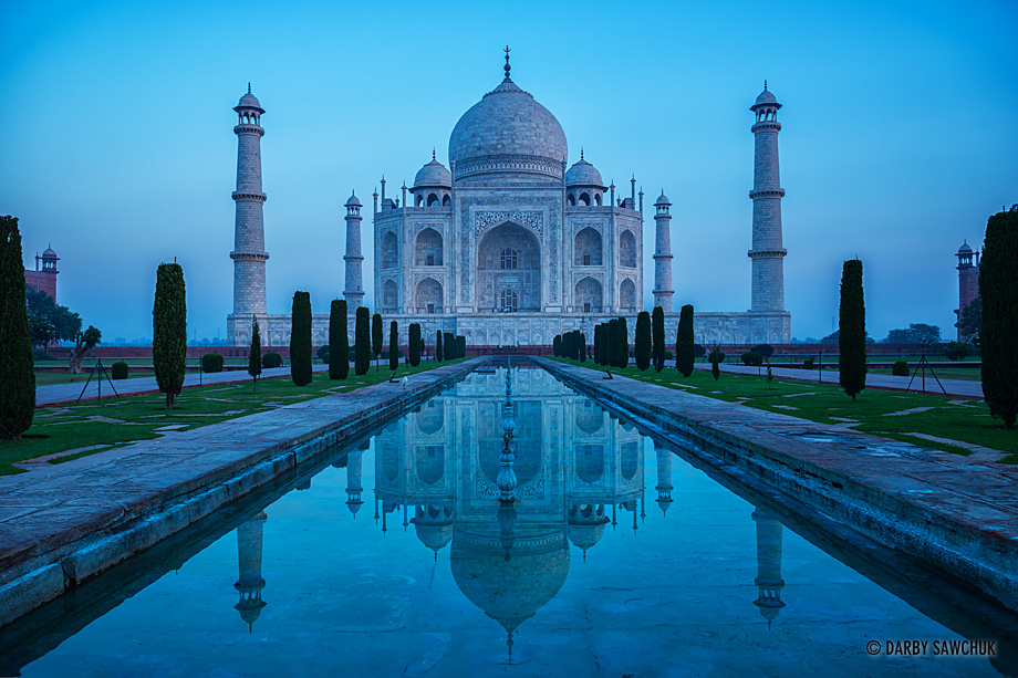 The classic view of the Taj Mahal mirrored in its reflecting pools.