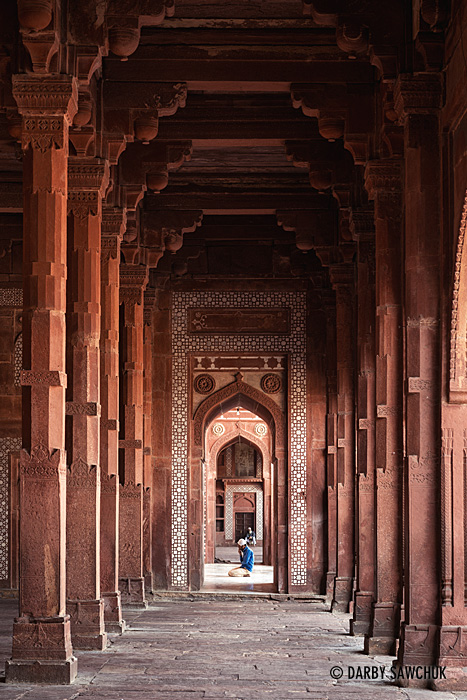 A man prays at the end of a colonnade inside Jama Masjid, near Fatehpur Sikri.