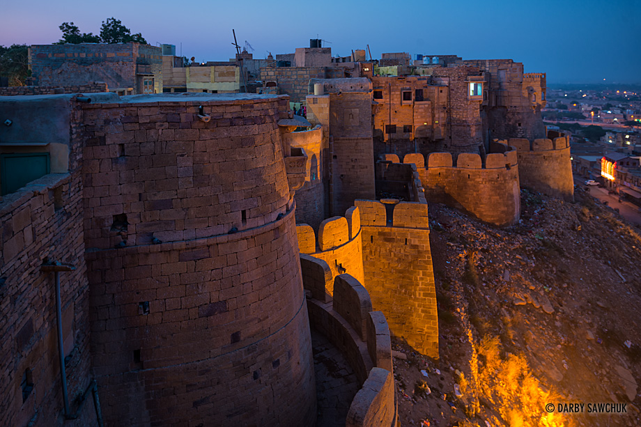 The towers and walls of Jaisalmer fort before dawn.
