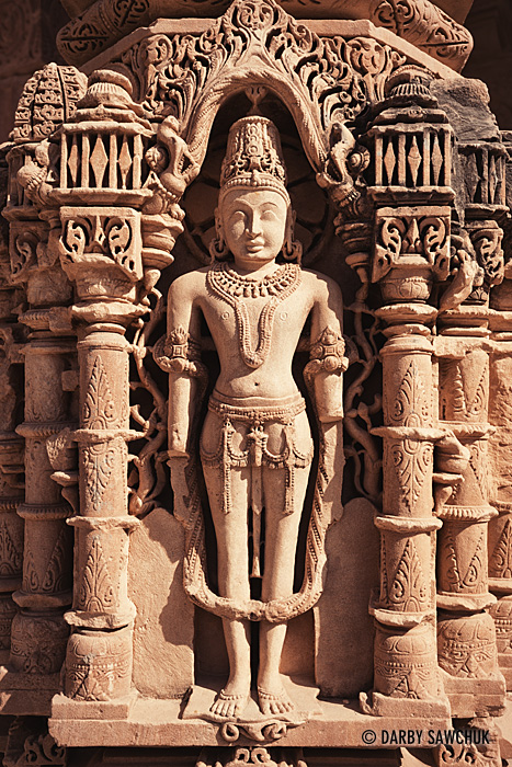 A detailed carving decorates one of the columns at the Jain Mahavira Temple in Osian.