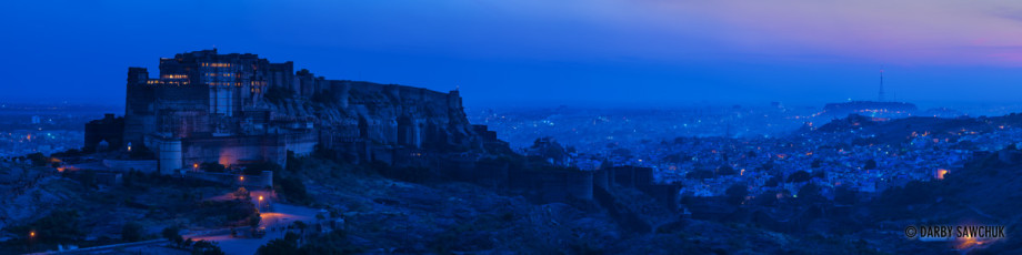 A panoramic view of Jodhpur's Mehrangarh Fort at dusk.