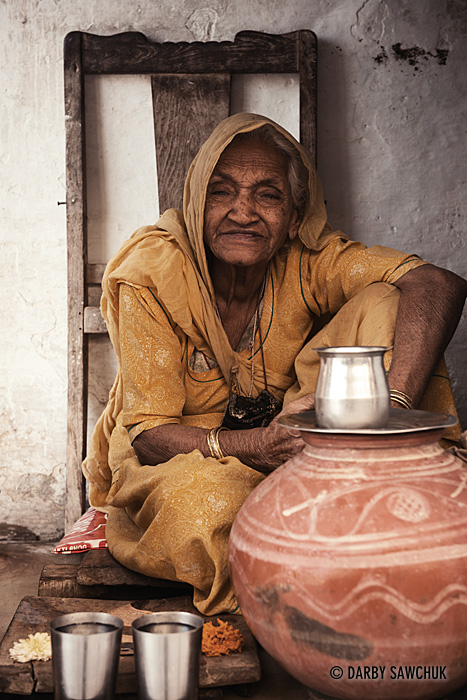 A woman serves tea at the Jagdish Temple in Udaipur.