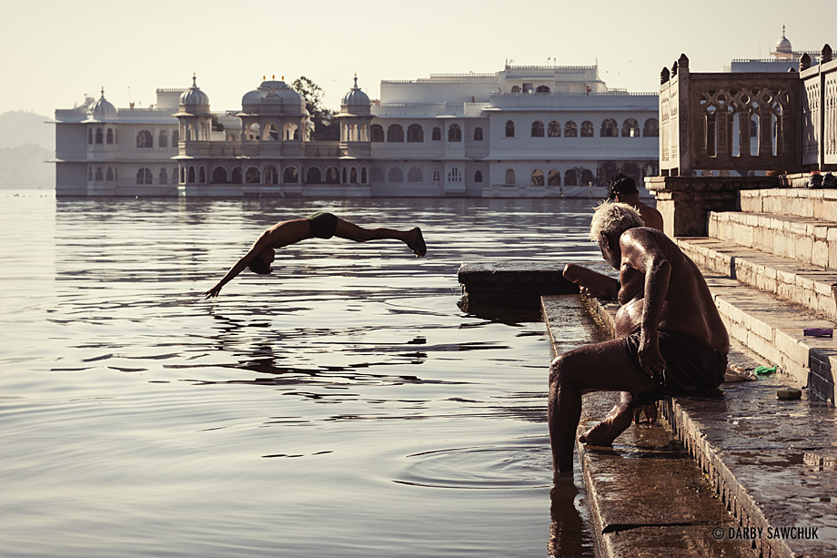 A man dives into the water of Lake Pichola from the Dhobi Washing Ghat in Udaipur.