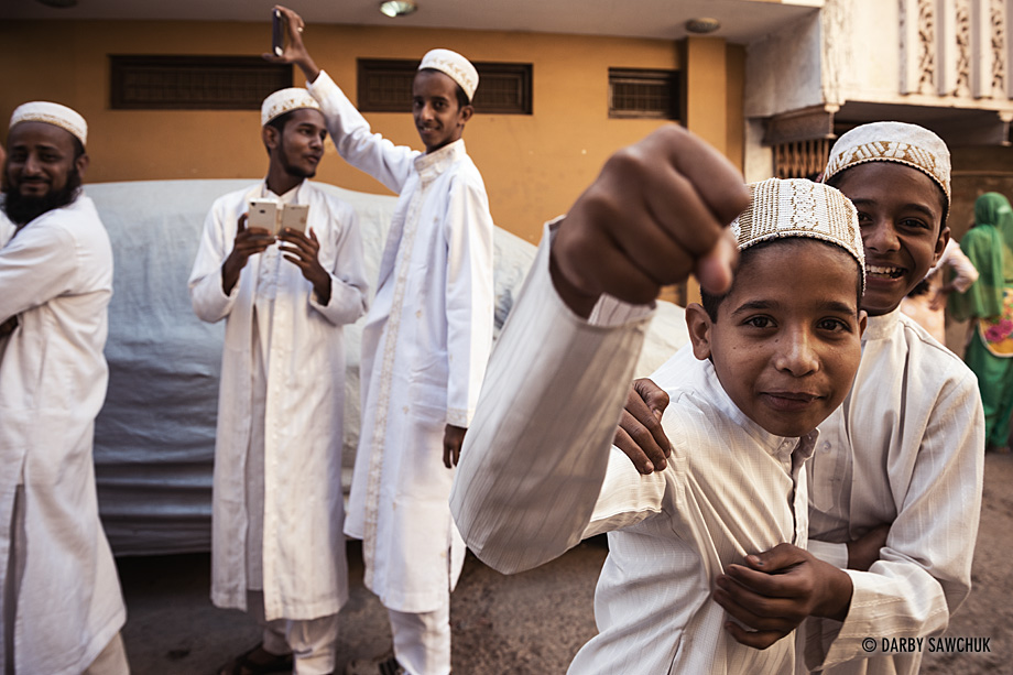 Children mug for the camera outside of a Muslim wedding in Bundi.