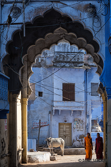 A blue-tinted archway towers over a street in Bundi, Rajasthan.