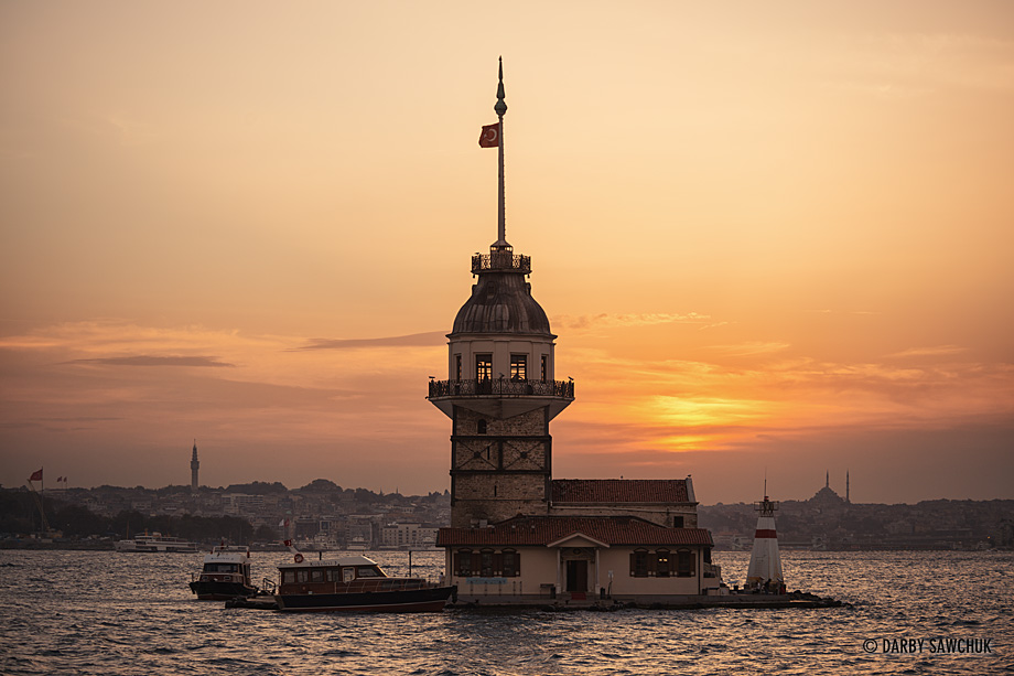 The Maiden's Tower, (Kiz Kulesi) a tower on an islet in the Bosphorus strait in Istanbul, Turkey at sunset.