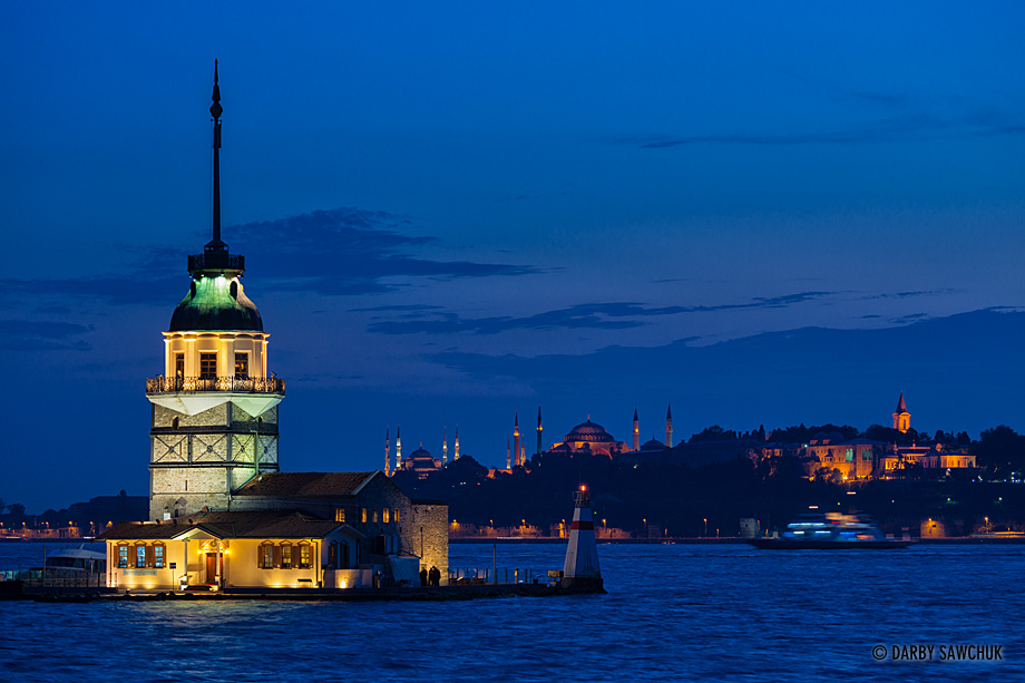 The Maiden's Tower, (Kiz Kulesi) a tower on an islet in the Bosphorus strait in Istanbul, Turkey at dusk.
