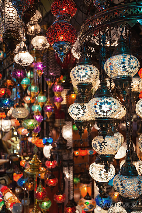 Ornate, colourful, glass lanterns hang outside of shops in the Grand Bazaar in Istanbul.