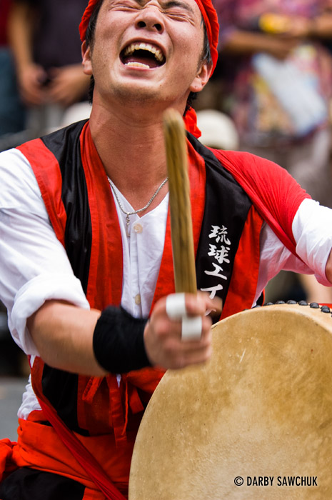 A drummer performs at a drumming and dancing summer festival in Shinjuku, Tokyo, Japan.