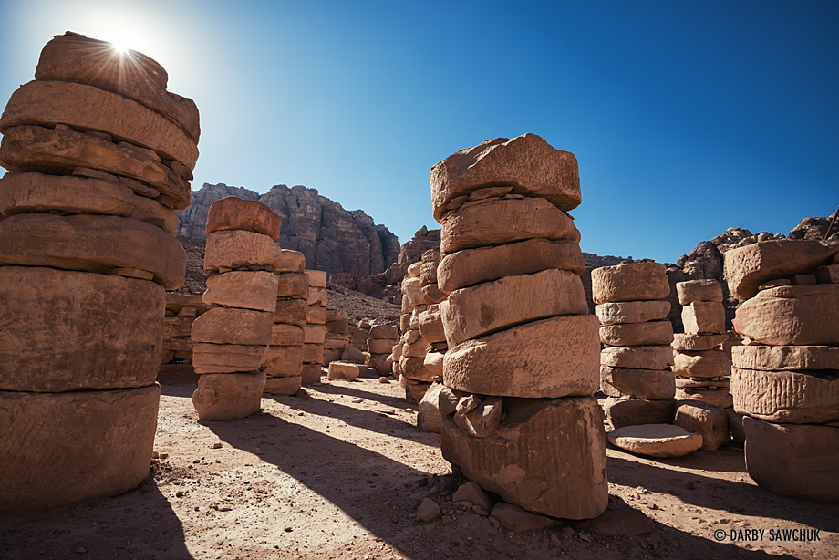Stacked sandstone columns among the ruins near the great temple at Petra.