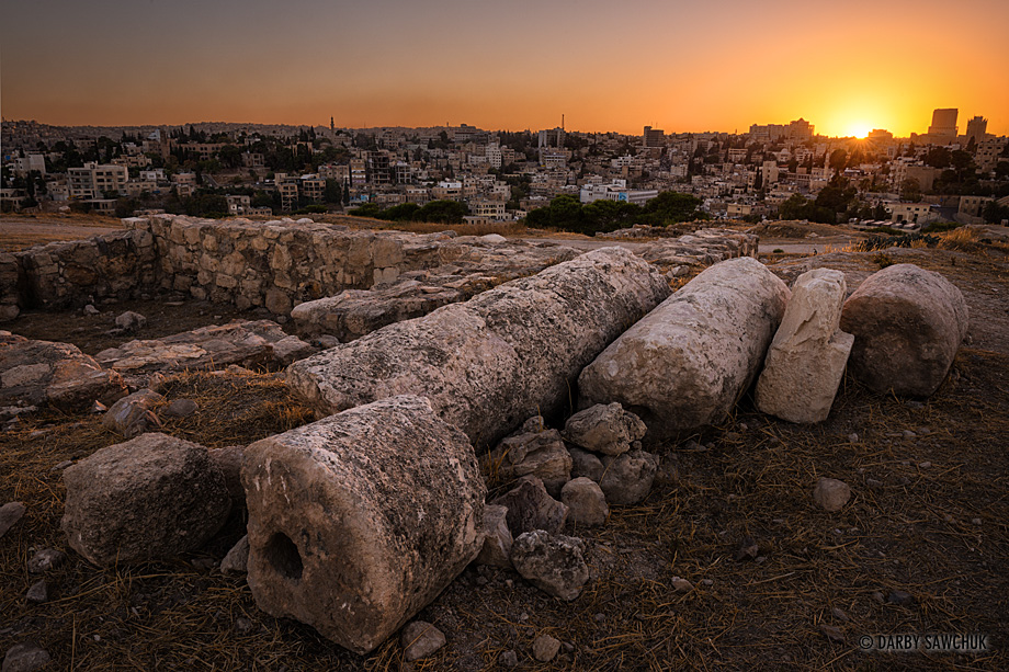 Sunset light bathes ruined Roman columns at the Citadel atop Amman, Jordan.