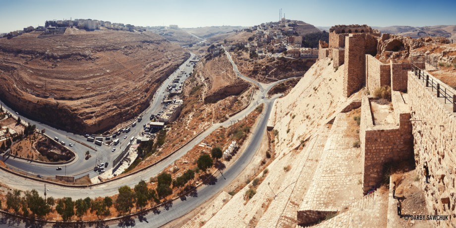 The walls of Karak castle high atop the hills overlooking Karak, Jordan.