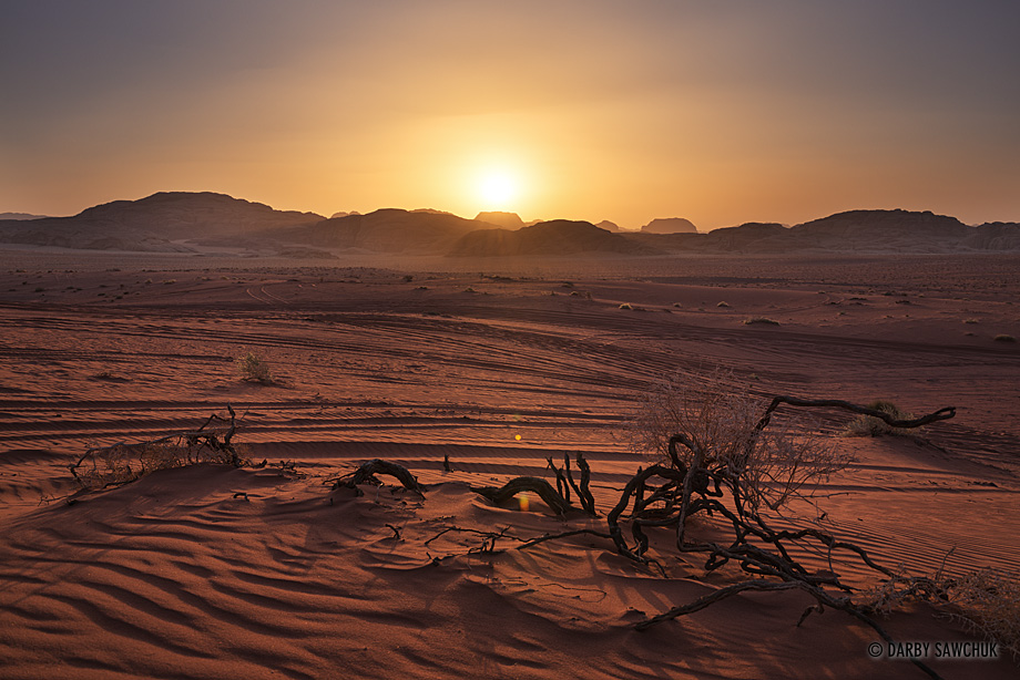 Sunset over the dunes and jebels of Wadi Rum.