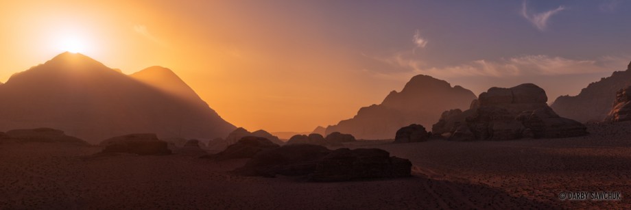 The sun rises over one of the peaks of Wadi Rum's jebels.