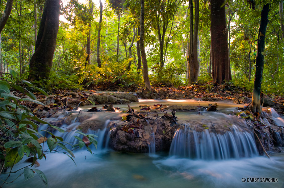 Rivers cascade through the jungle at Kuang Si Falls.