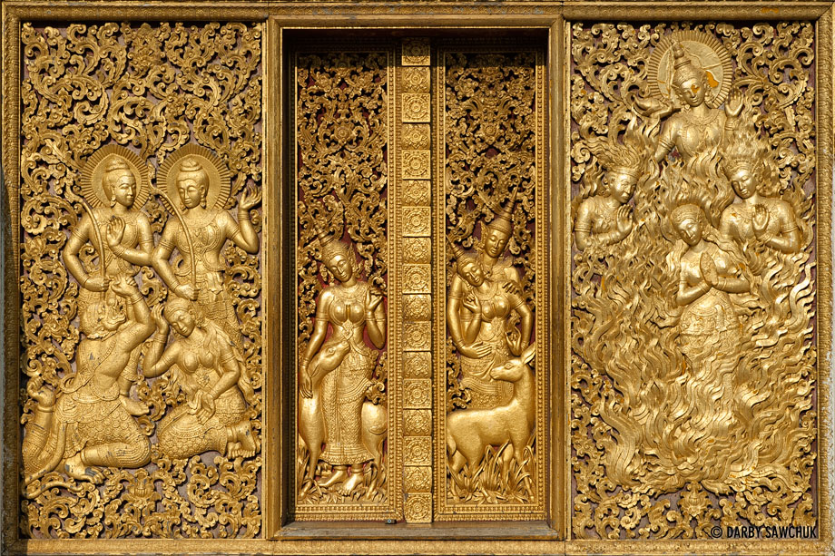 The ornate, golden carvings on the doors of Wat Xieng Thong in Luang, Prabang.