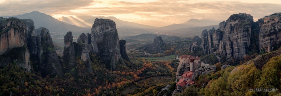 A panoramic view of the Monastery of Rousanou looking out onto the enormous sandstone pillars of the Meteora area of Greece.