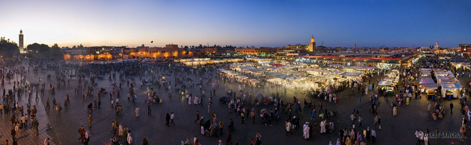 A panoramic view of Djemaa El-Fna, the main square of Marrakech at dusk.