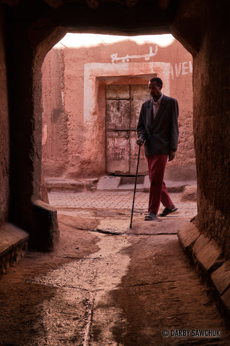 A man walks in an alley in Ouarzazate, Morocco.