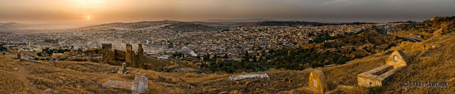 A panoramic view of labyrinthine Fez from a cemetery in the hills above at dawn.