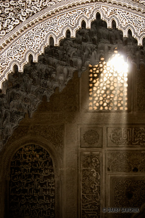 Light filters in through a window in Merdersa Bou Inania in Meknes, Morocco.
