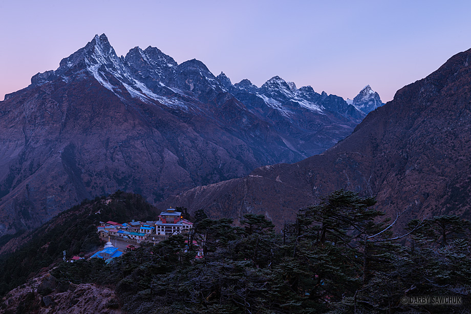 A pre-dawn glow reveals Tengboche Monastery nestled among the Himalayas.