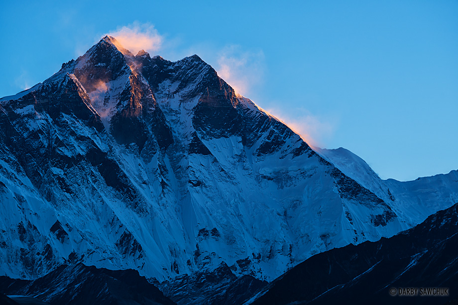 The first rays of dawn strike the summit of Lhotse, the fourth highest mountain in the world.