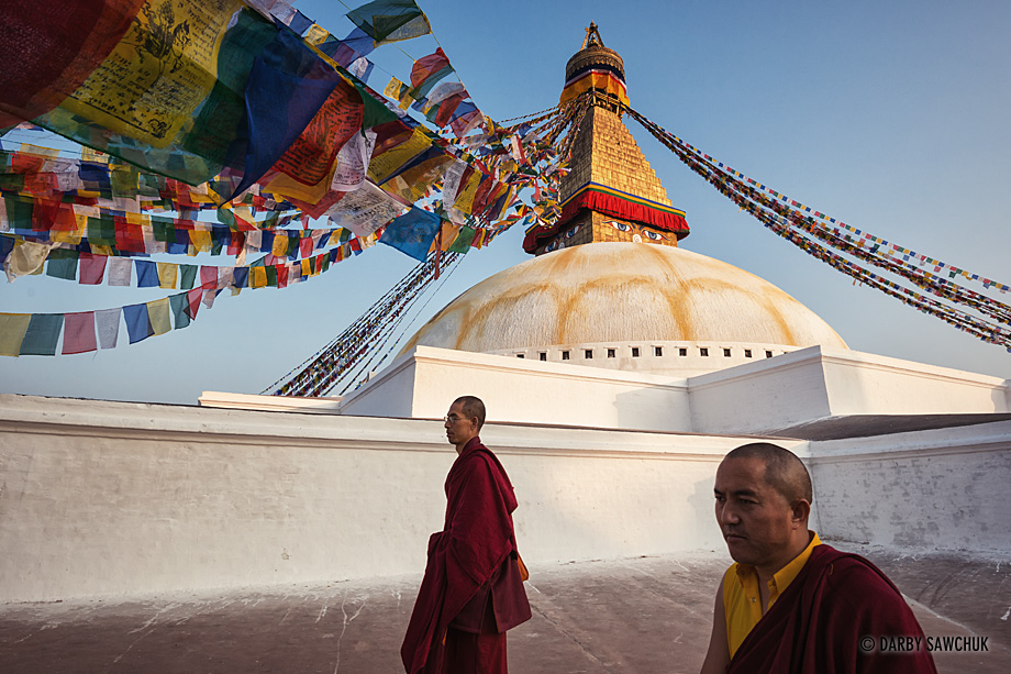 Buddhist monks walk in a circle around the Boudha Stupa in Kathmandu, Nepal.