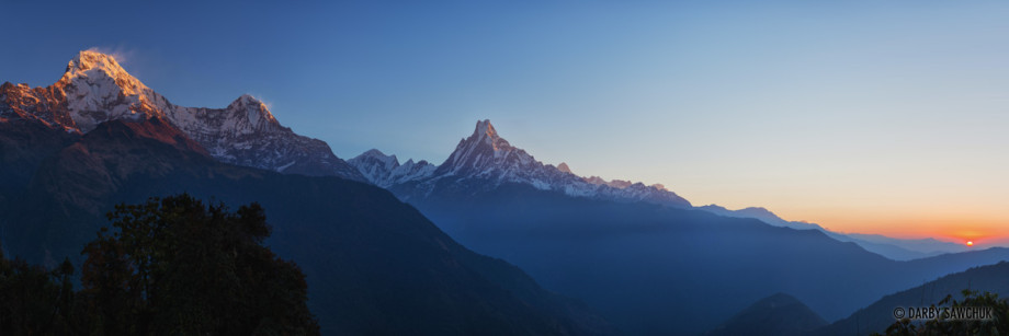 A panoramic photo of the Annapurna mountains as viewed from Tadapani with Machhapuchchhre at the centre.