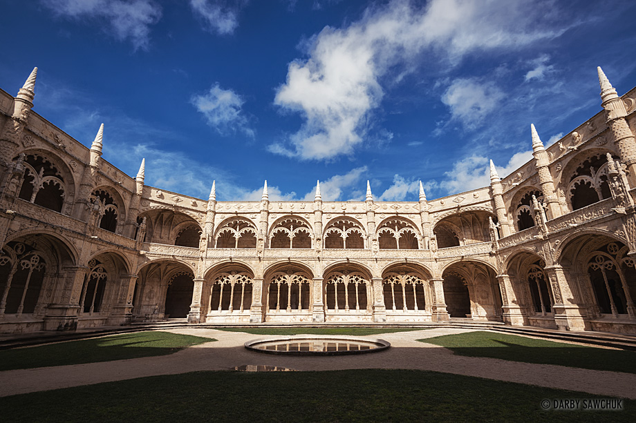 The two-storey cloisters surrounding the central courtyard of the Jerónimos Monastery, in Lisbon, Portugal.