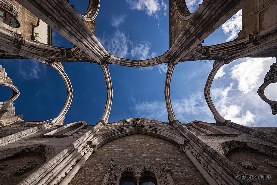 The ruin of the medieval Carmo Convent is open to the blue skies above.