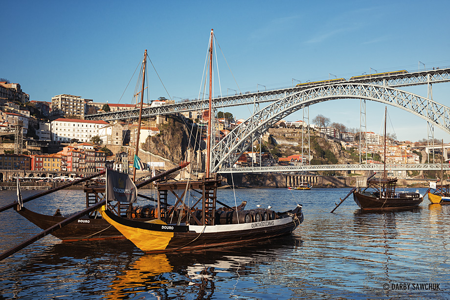 Rabelo boats floating in the River Douro in front of the Luís I Bridge from Vila Nova de Gaia.