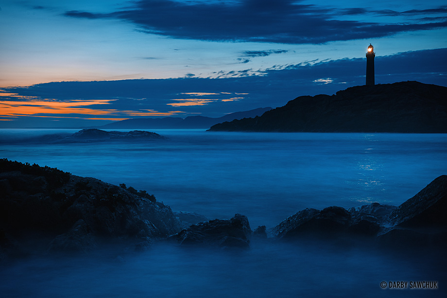 The lighthouse at Ardnamurchan Point shines out through the evening light in western Scotland.